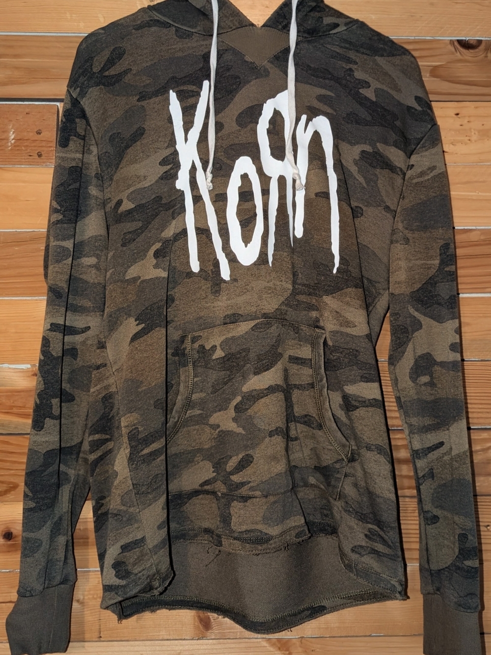 Kori Hoodie with White Logo on Tan Background
